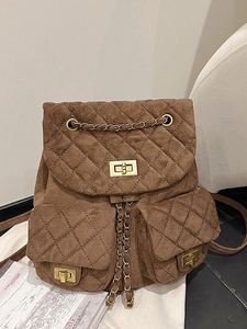 Quilted dark brown suede mini backpack with golden chain straps and turn-lock pockets
