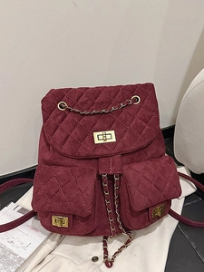 Burgundy quilted suede mini backpack with gold chain straps and front lock pockets