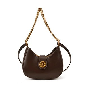 Dark brown crescent leather hobo bag with chunky gold chain strap and turn-lock