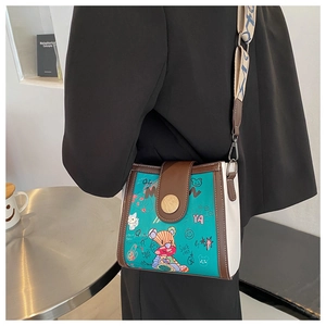 Fashionable crossbody bucket bag with bear graffiti design and wide strap detail
