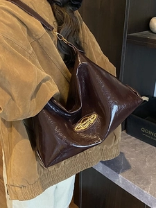 Large capacity dark brown patent leather tote bag with glossy finish and gold logo