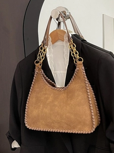 Vintage brown suede shoulder bag with woven leather edges and gold chain strap handle