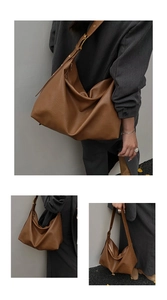 Brown soft leather tote bag with gold hardware detail and adjustable shoulder strap