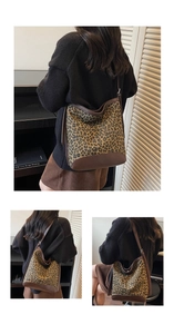 Detail view of leopard print tote bag featuring brown leather trim and magnetic metal clasp