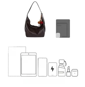 Large brown hobo tote bag detail showing capacity for 11-inch iPad Pro and daily items