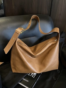 Brown leather large capacity hobo shoulder bag with golden hardware and wide strap