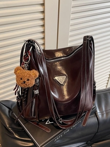 Retro deep brown high-gloss leather tote bag with shoulder straps and teddy bear charm