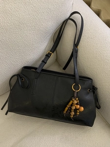 Retro black leather shoulder bag with wooden gourd charm and adjustable straps