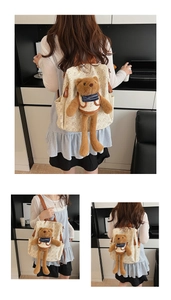 Detail of cute cream backpack with bear prints and a 3D plush bear charm accessory