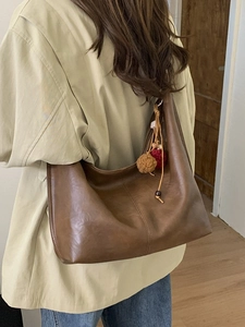 Retro dark brown oversized tote bag in soft oil-wax faux leather with a woven charm