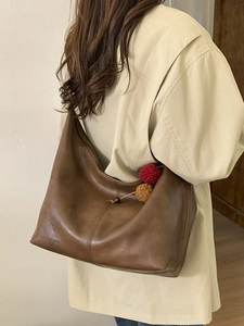 Retro brown leather hobo tote bag with plush charm, large shoulder bag for daily casual style