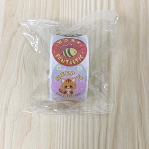 Roll of cartoon animal reward stickers with cat and bee designs in clear plastic wrap