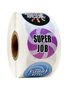 Macro shot of roll-packed reward stickers with Awesome and Good Job motivational phrases