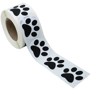 Roll of black and white paw print stickers for pet decor and DIY envelope sealing