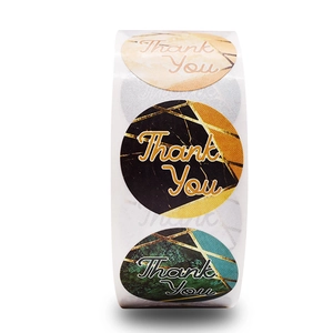 Roll of marble-textured round Thank You stickers with gold geometric accents