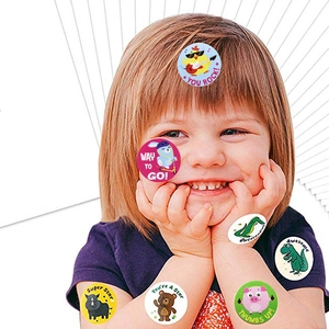 Cute girl showing colorful reward stickers with cartoon animals and motivational phrases