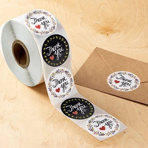 Roll of floral Thank You stickers with colorful wreaths for envelope and gift sealing