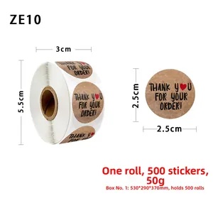 Detail of 1-inch kraft paper thank you stickers roll with red heart and gold foil text