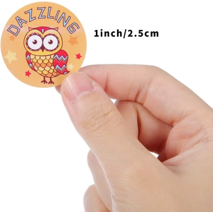 Adhesive animal sticker with red owl and Dazzling text held by hand for size