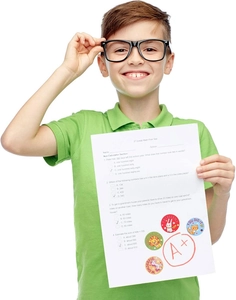 Boy showing A+ math test with colorful cartoon animal reward stickers and labels
