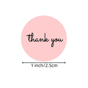 Pink 1-inch thank you sticker roll with black cursive lettering on white background