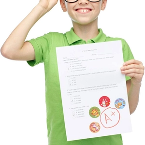 Roll of cartoon animal reward stickers with encouraging words for school children