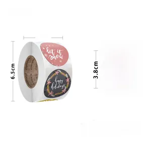 Detail of Christmas roll stickers showing 3.8cm diameter let it snow and happy holidays designs