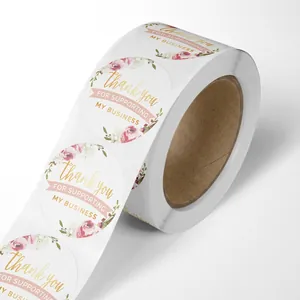 Roll of floral Thank You stickers with gold lettering for small business packaging