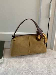 Vintage olive suede pillow bag with brown leather handles and gold metal hardware