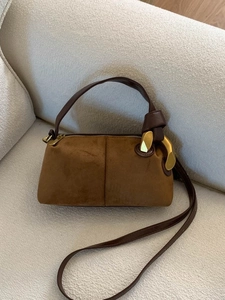 Brown suede pillow handbag with premium gold hardware and leather shoulder strap