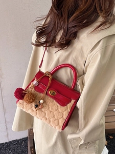 Elegant red and beige faux fur handbag with heart texture and gold twist lock