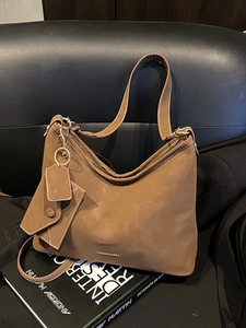 Vintage brown suede hobo bag for women with gold hardware and small hanging pouch