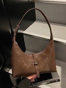 Retro coffee brown half-moon hobo bag with adjustable strap and metal ring detail