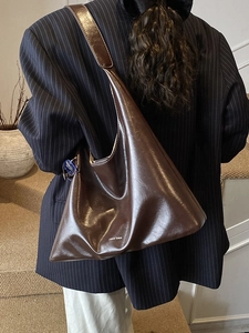 Minimalist large brown glossy leather tote bag for women with wide shoulder strap