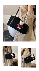 Detail of black matte suede tote bag featuring a cute white teddy bear plush charm