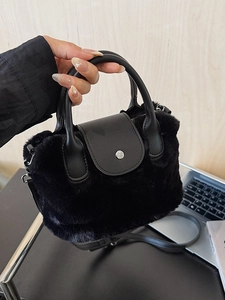 Faux fur handbag in black with leather flap and detachable strap for versatile styling