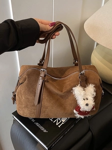 Brown suede tote bag with leather strap and plush puppy charm for autumn casual commute