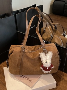 Brown faux suede Boston tote bag with cute plush dog charm for autumn winter fashion