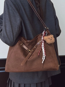 Brown suede large tote bag with bear charm and metallic accents in vintage style