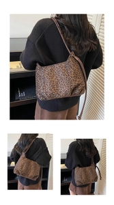 Detail of leopard print hobo bag showing the plush texture and brown shoulder strap