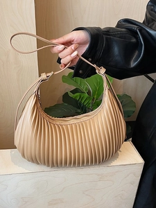Chic pleated crescent shoulder bag in khaki with adjustable strap and vertical texture