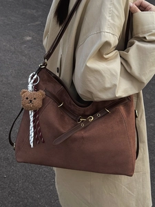 Fashionable dark brown large capacity faux suede tote bag with a cute bear charm for women