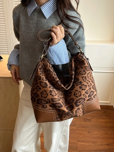 Brown leopard print suede tote bag with leather trim and long shoulder straps