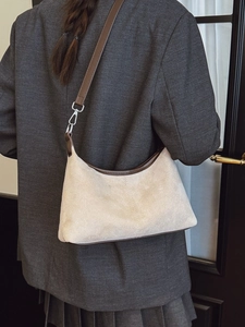 Vintage suede tote bag in beige with dark brown shoulder strap and metal buckle