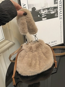 Winter plush drawstring bucket bag in beige fur with dual carrying straps