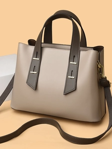 Minimalist beige and brown tote bag with top handles and detachable shoulder strap