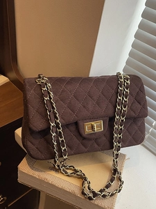 Quilted chocolate brown suede shoulder bag with golden chain and twist lock closure