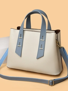 Minimalist beige and blue tote bag with litchi texture and golden hardware