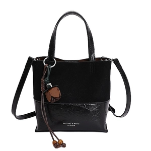 Minimalist black bucket bag with suede texture splicing and vintage flower pendant