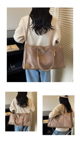 Detailed views of a large travel bag with dual handles and adjustable shoulder strap